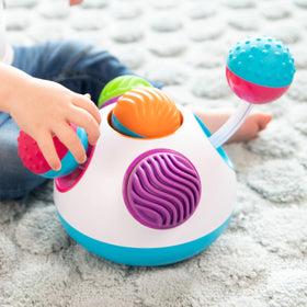Fat Brain Toys Klickity clicking sounds stimulate auditory interest during hands-on play sessions.