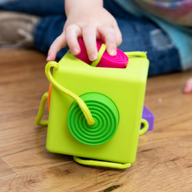 Shapes slot into the OombeeCube to support shape recognition.