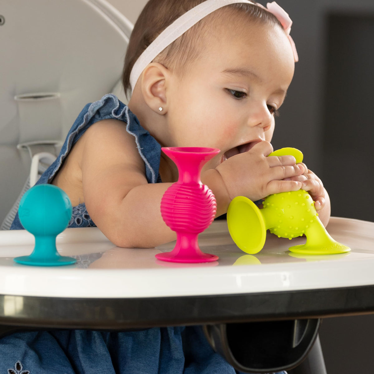 Fat Brain Toys pipSquigz suction cups enable versatile play on surfaces