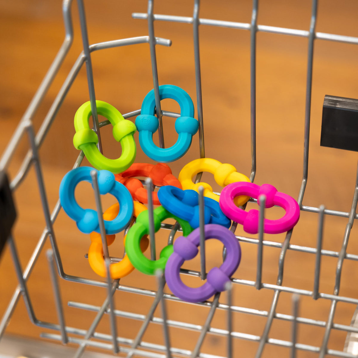Fat Brain Toys Plip Links come in vibrant colors inviting experimentation and pattern creation.