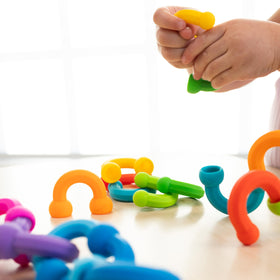 Fat Brain Toys Plip Links dishwasher-safe silicone construction supports easy cleanup after building sessions.