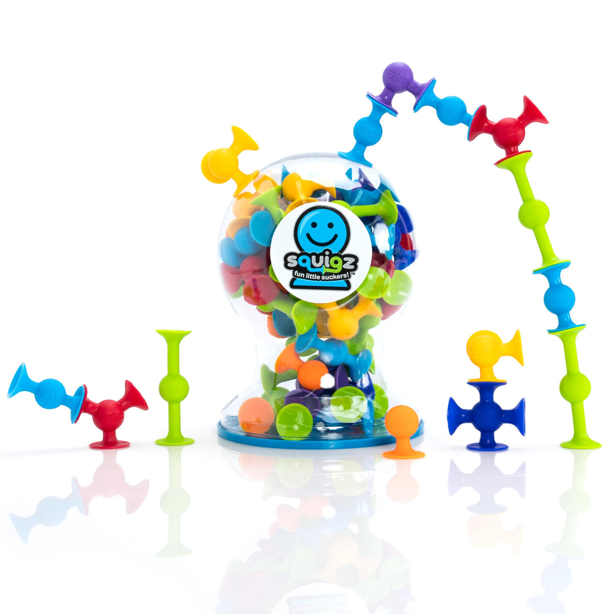 Fat Brain Toys Squigz Deluxe Set on a table with colorful suction shapes for creative play