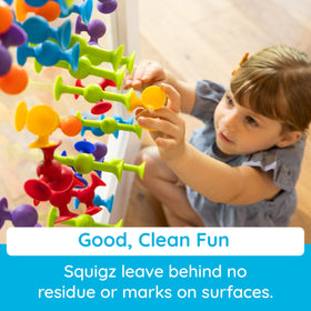 Fat Brain Toys Squigz pieces defy gravity with playful suction experiments on tub walls