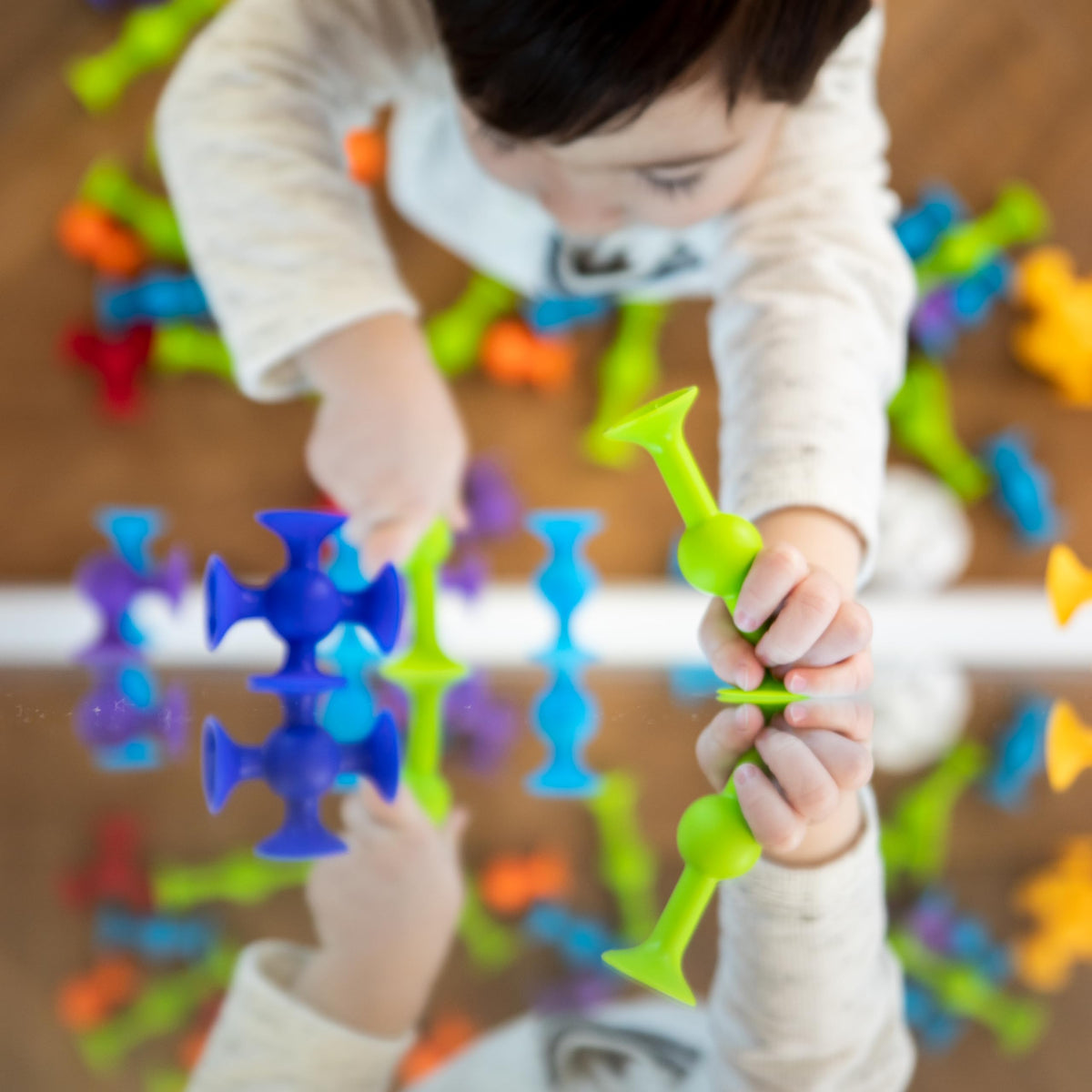 Fat Brain Toys Squigz encourage collaborative play for families during bath or playtime