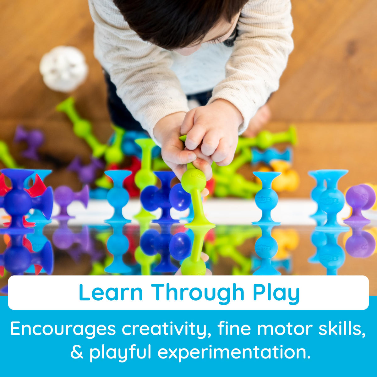 Fat Brain Toys Squigz on mirrors or tiles adds versatile bath-time science-like play