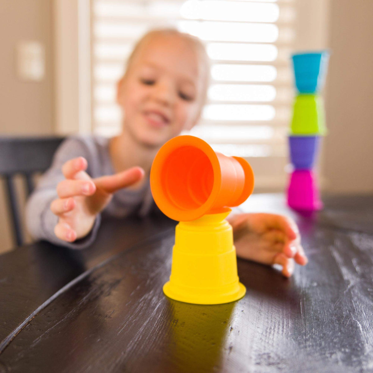 Fat Brain Toys Suction Kupz compact cups fit small hands.