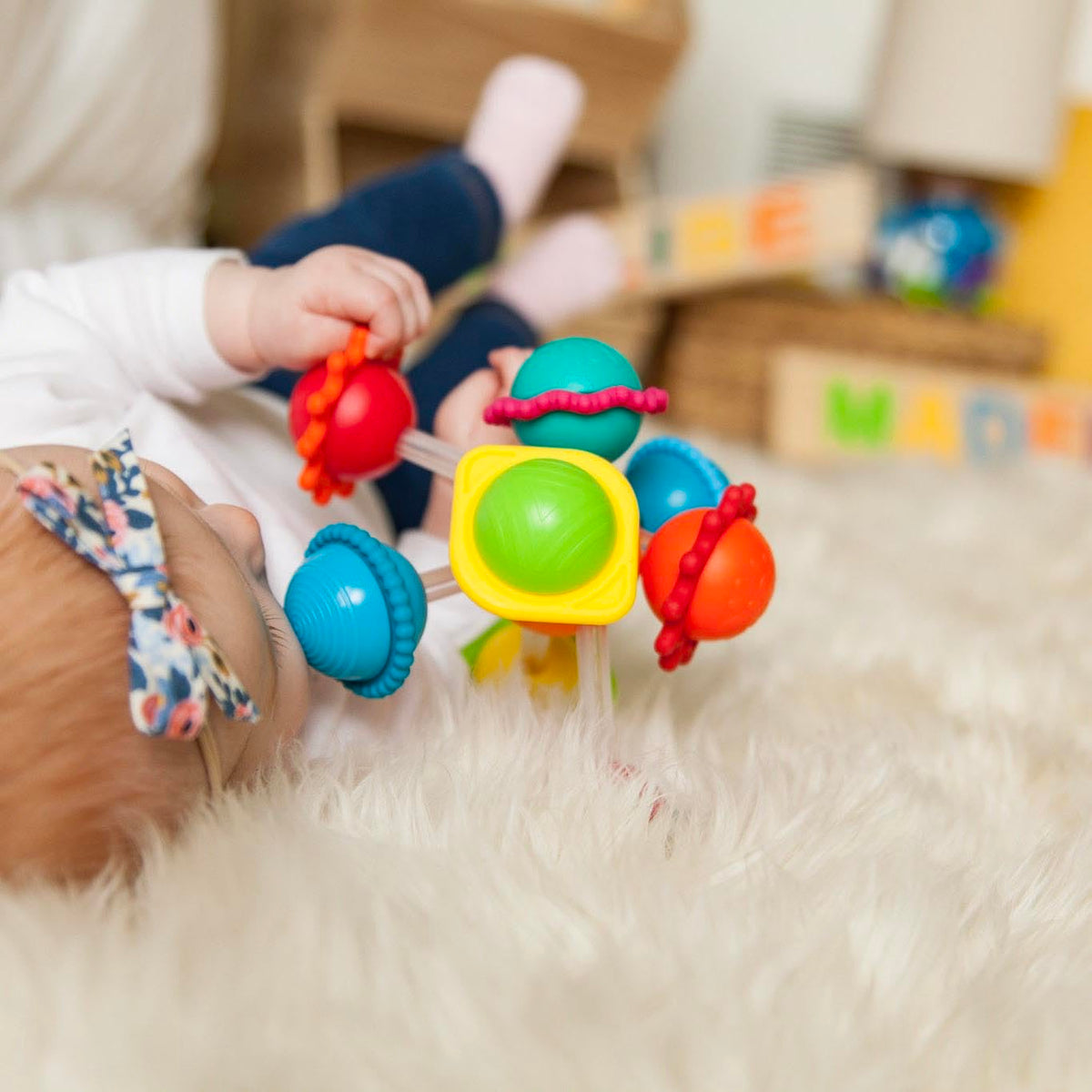 Wimzle silicone rings provide textural teething-inspired play.