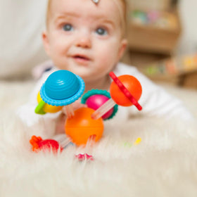 Wimzle squishy baby toy invites squeezing and twisting.