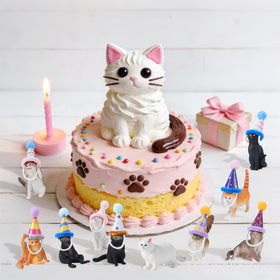 FCKLVMC paper birthday hat on a cat figure for playful decor.