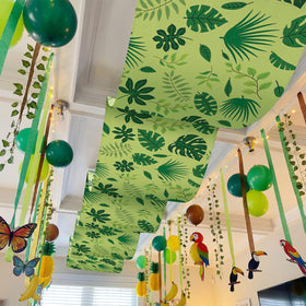 Feifeiya forest leaves banner pairs well with other jungle decor pieces.