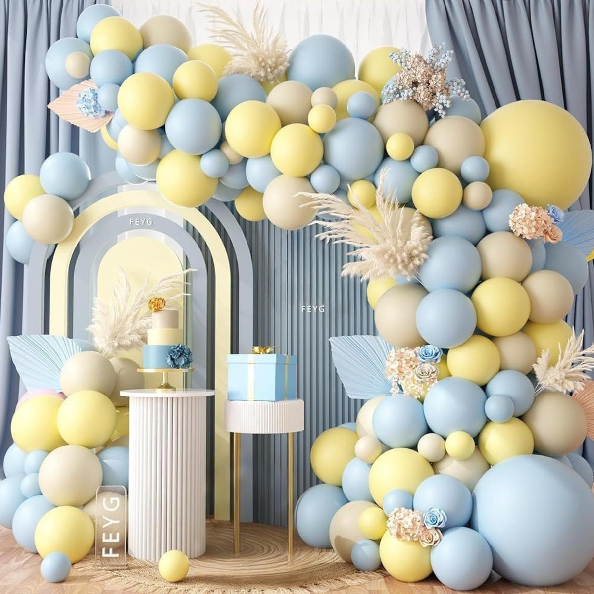 FEYG pastel blue yellow balloon garland arch setup for a festive backdrop