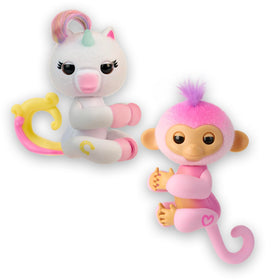Fingerlings Harmony and Lulu 2-pack on desk with heart lights for playful, imaginative moments.