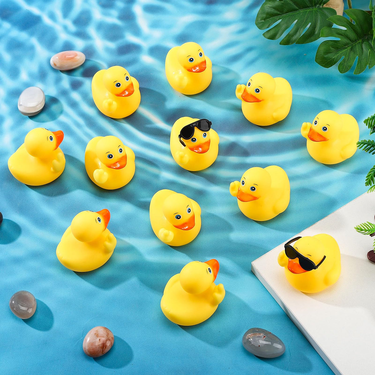 Fingertip WD rubber ducks decorate pool parties and showers.