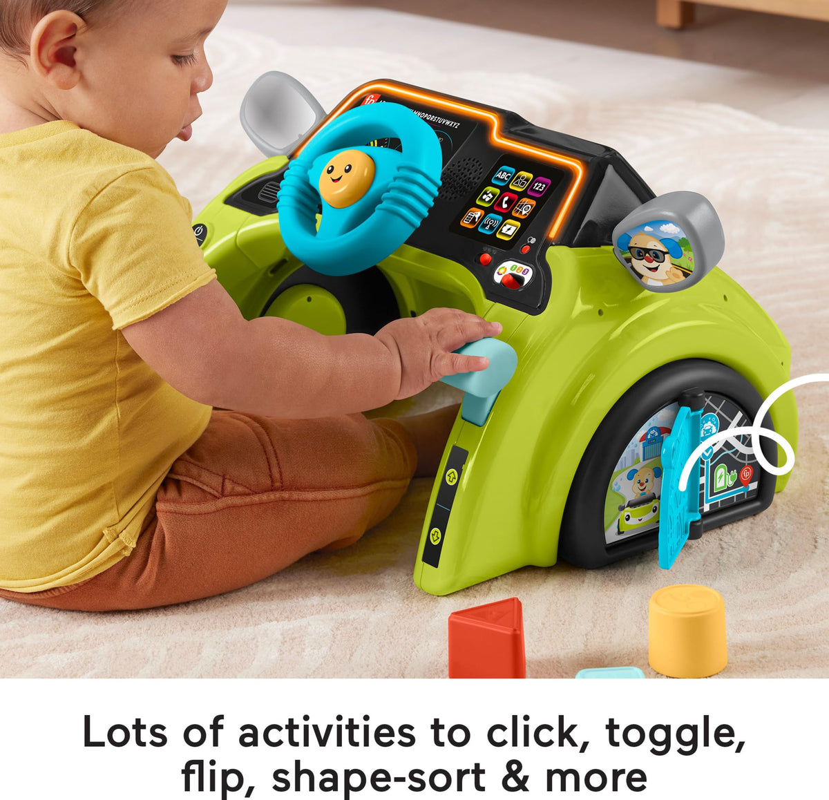 Gear shifter clicker on Fisher-Price driver invites tactile exploration and learning through action.