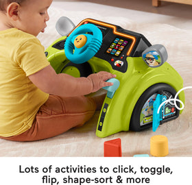 Gear shifter clicker on Fisher-Price driver invites tactile exploration and learning through action.