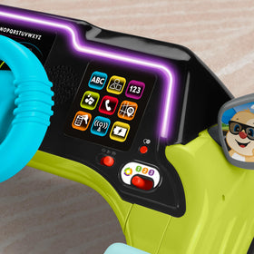 Lock toggle on Fisher-Price Sit & Steer Driver adds dexterity and problem-solving activities.