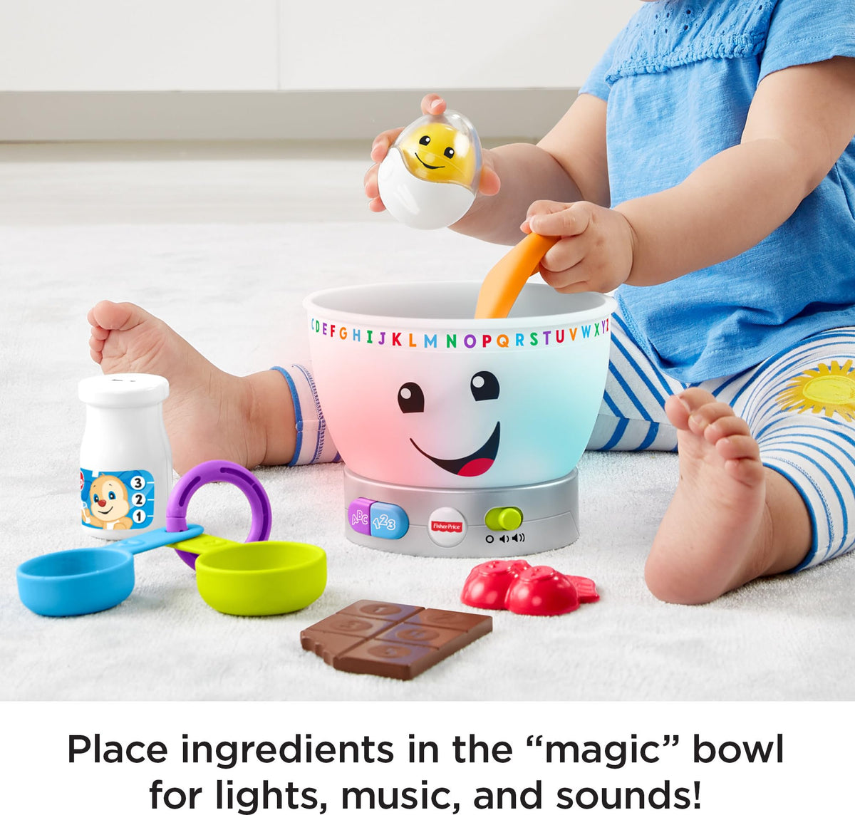 Fisher-Price rattle egg and measuring cups encourage grasping skills