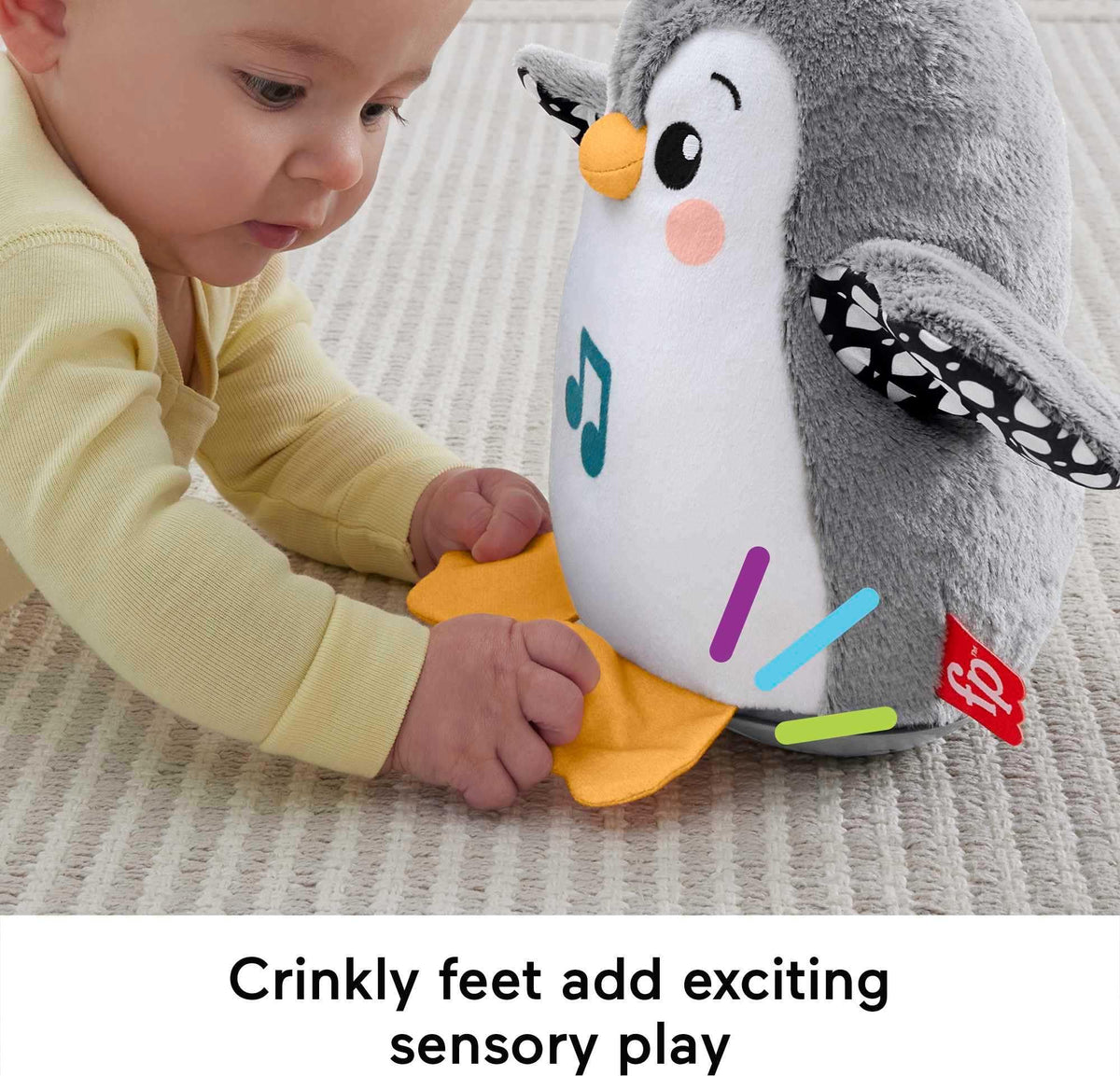 Fisher-Price Flap & Wobble Penguin soft plush and crinkle textures engage tactile senses.