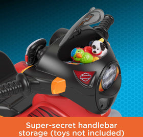 Lights and sounds on Harley-Davidson trike enhance pretend riding play.