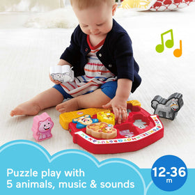 Close-up of farm animal shapes and songs from Fisher-Price puzzle
