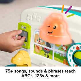 Fisher-Price Laugh & Learn kitchen refrigerator door opens to teach colors and shapes.