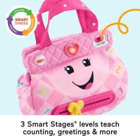 Fisher-Price Laugh & Learn Smart Purse open-handle action activates friendly tunes.