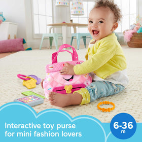 Fisher-Price Laugh & Learn Smart Purse zipper action triggers songs during pretend play.