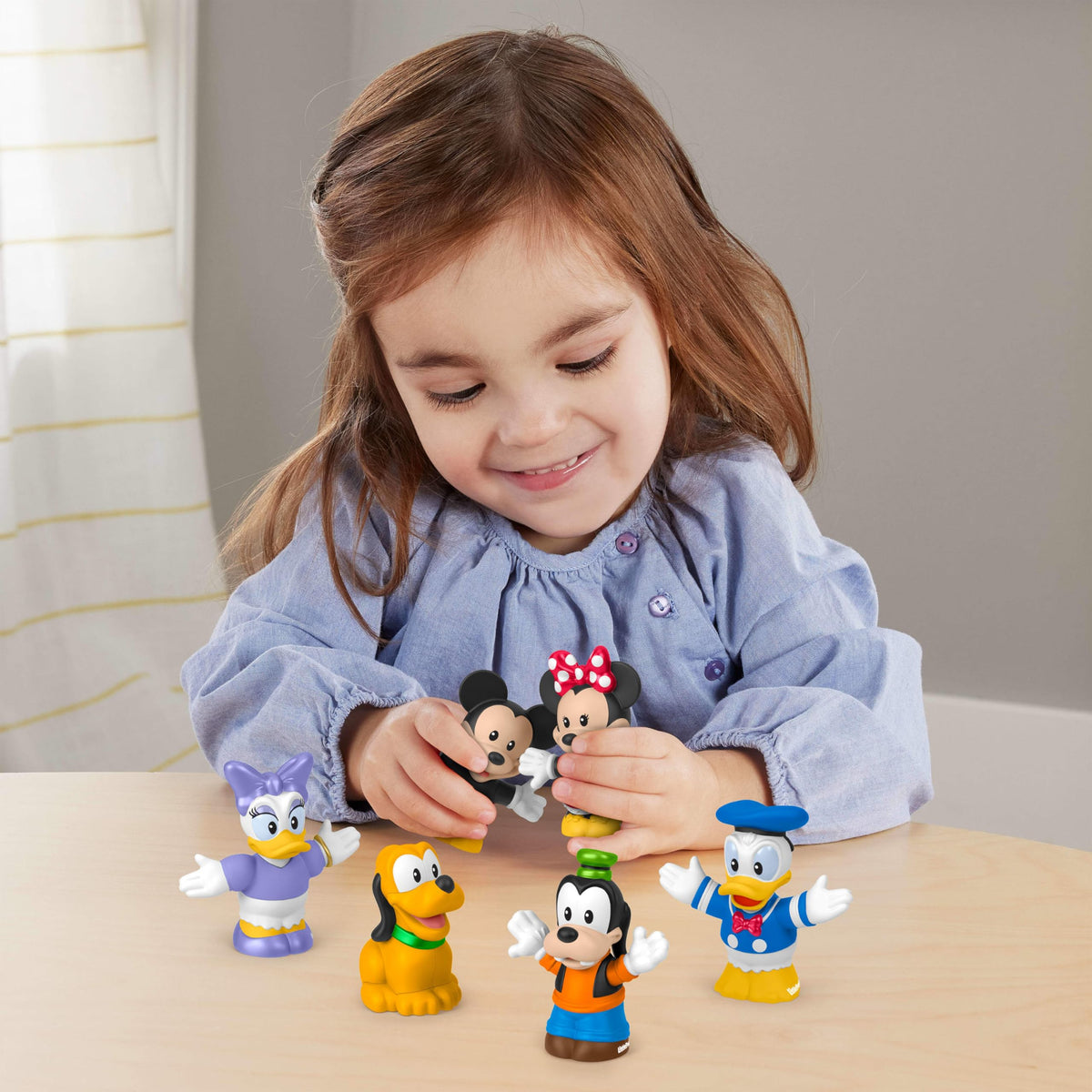 Fisher-Price Little People Minnie Mouse figure designed for fine motor play and imagination