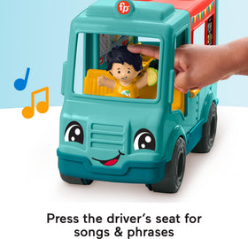 Top of Fisher-Price Little People food truck flips open to outdoor dining area