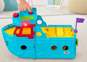 Fisher-Price Little People Travel Together Friend Ship interior supporting storytelling and storage.