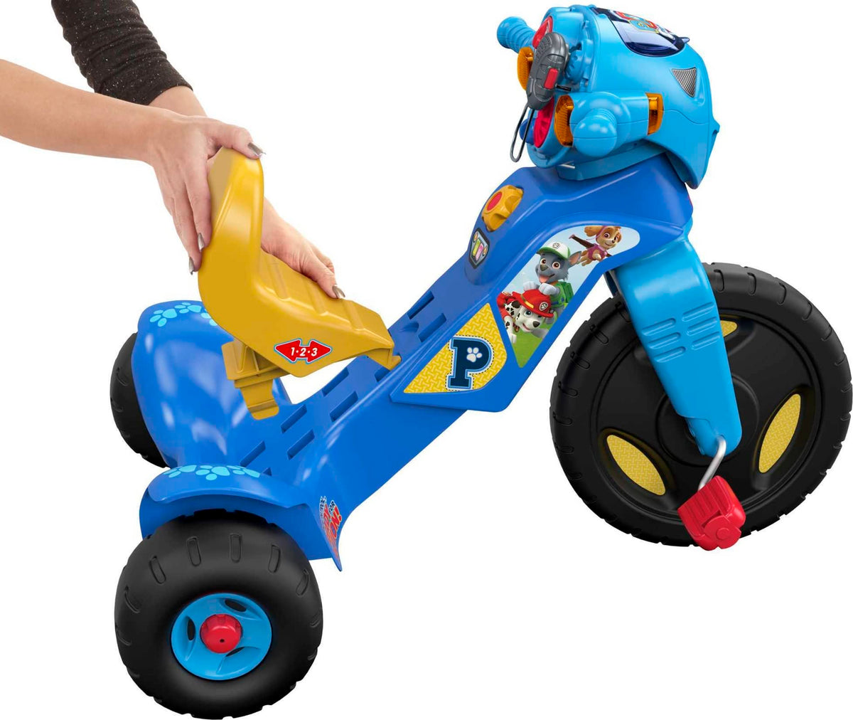 Fisher-Price PAW Patrol Trike lights and music during a ride to spark imaginative play.