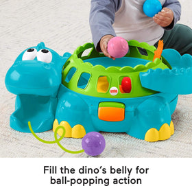 Fisher-Price Poppity Pop Dino belly holding six colorful balls inside