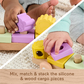 Fisher-Price push-along train in action supports gross motor exploration.