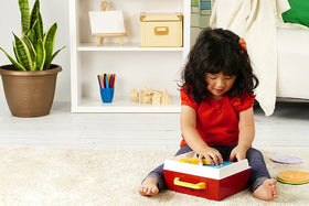 Fisher-Price record player showing five removable records for music play.