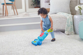 Fisher-Price Laugh & Learn vacuum push toy light-up canister button adds songs.