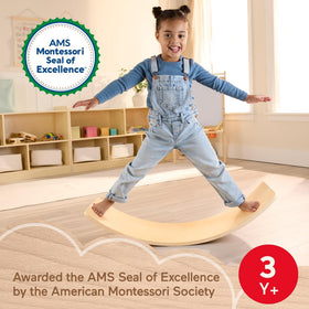 Fisher-Price Wood Montessori Rockin' Balance Board side view shows balance practice and coordination.