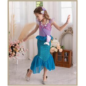 Fishkidtail Tale Coin Purse accessory adds magical finishing touch.