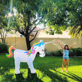 Float Joy unicorn sprinkler in backyard party setup for family fun
