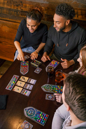 Floodgate Games Sagrada glass-favor tokens visible on the table boosting scoring options