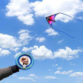 Flying Hoofer 7.1-inch kite string reel close-up shows smooth unwinding for easy setup