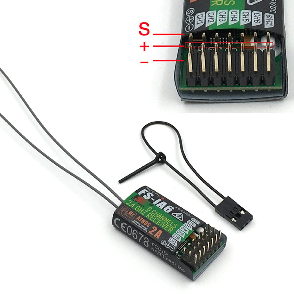 Flysky FS-i6 IA6 receiver close-up emphasizing small size and sensitivity