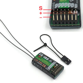 Flysky FS-i6 IA6 receiver close-up emphasizing small size and sensitivity