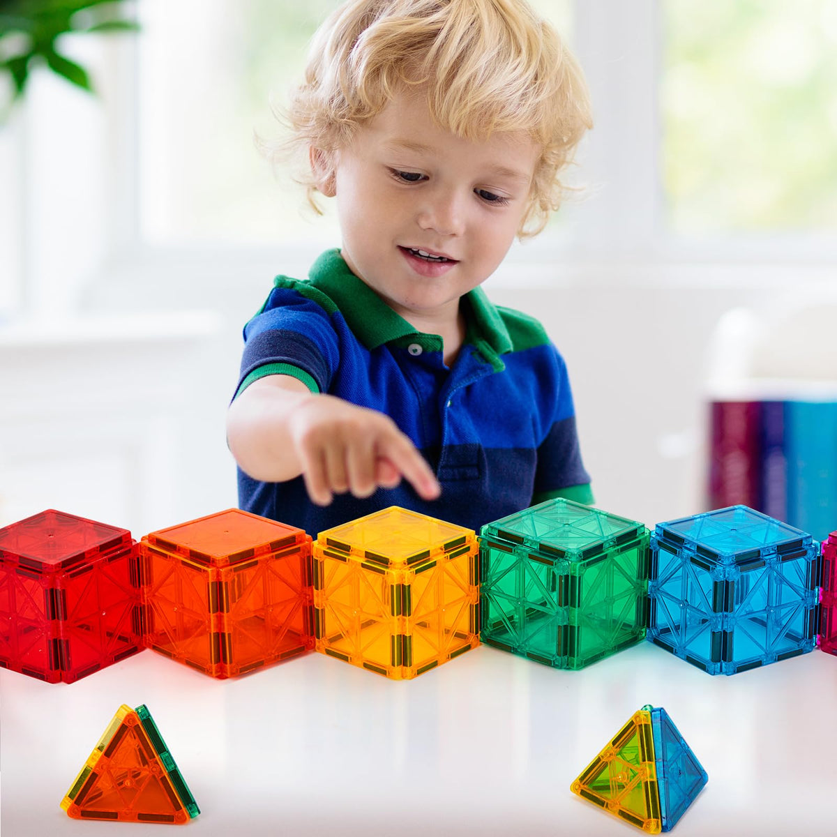 FNJO magnetic tiles child play demonstrates imaginative construction and cooperative activity.