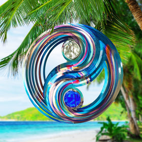 Stainless steel wind spinner with crystal ball under blue sky