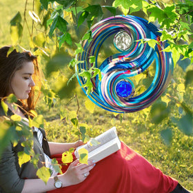 FONMY wind spinner hanging from a balcony railing with breeze