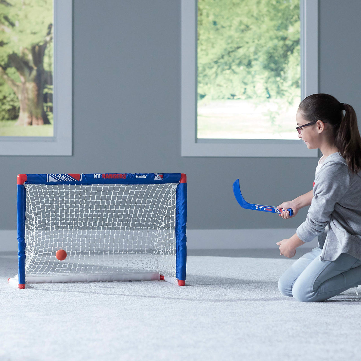 Kids enjoy knee hockey in real-life game-inspired moments.