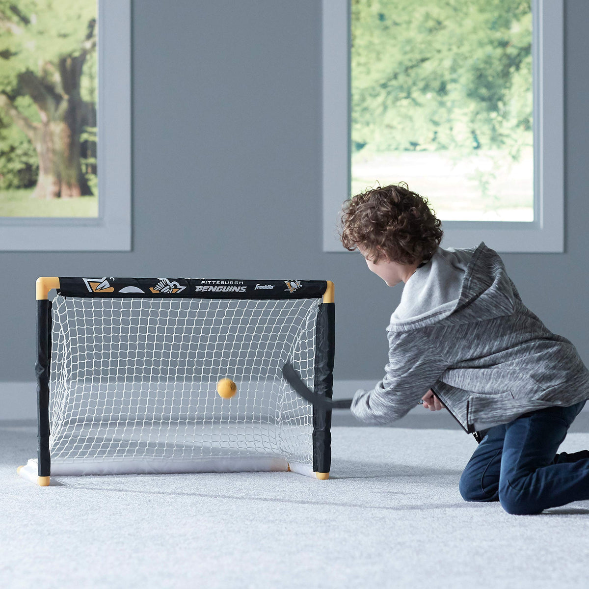Franklin Sports Penguins indoor knee hockey play for family fun.