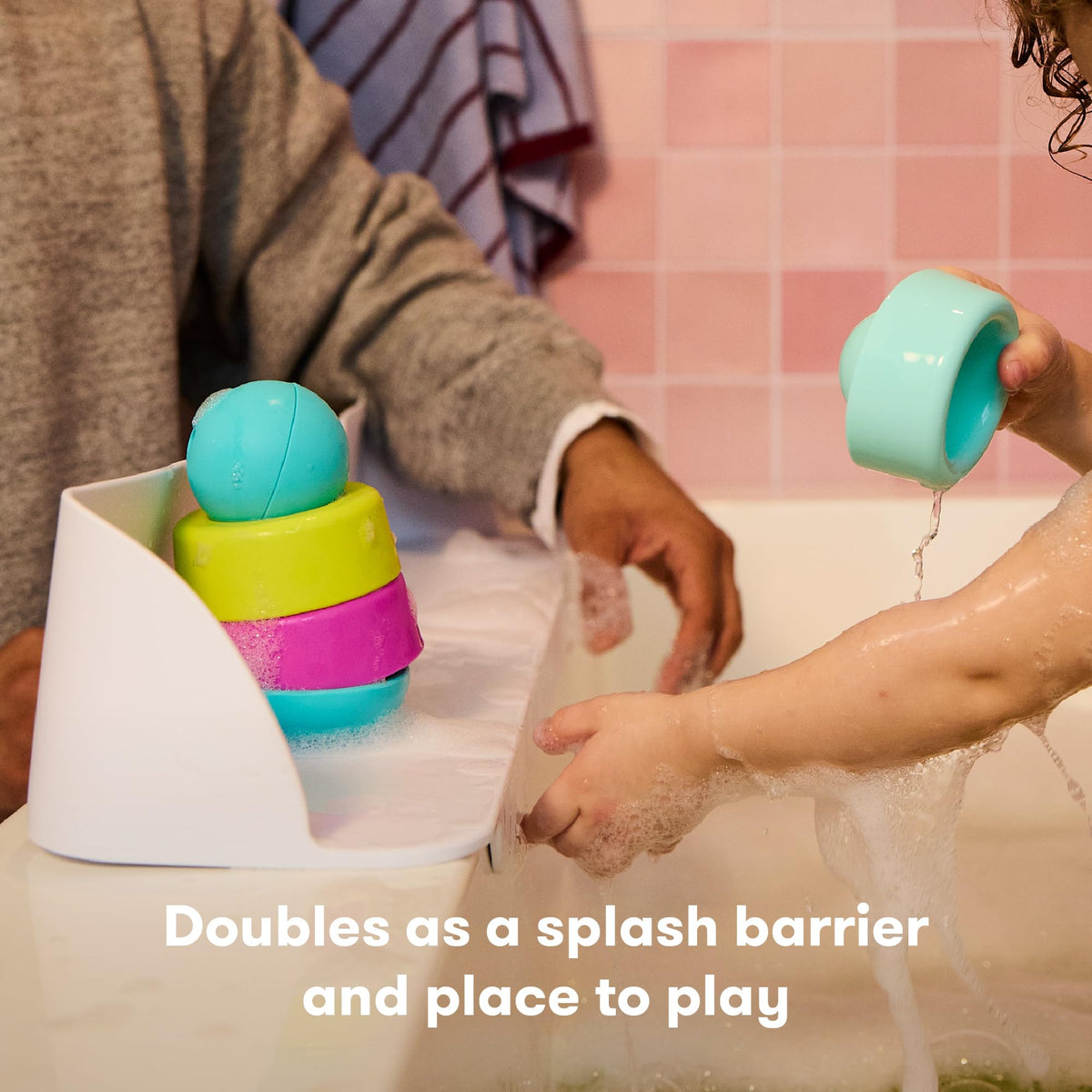 Frida Baby Splash Shelf extends tub space for safe play.