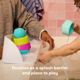 Frida Baby Splash Shelf extends tub space for safe play.