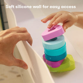 Frida Baby Splash Shelf folds away for compact storage.
